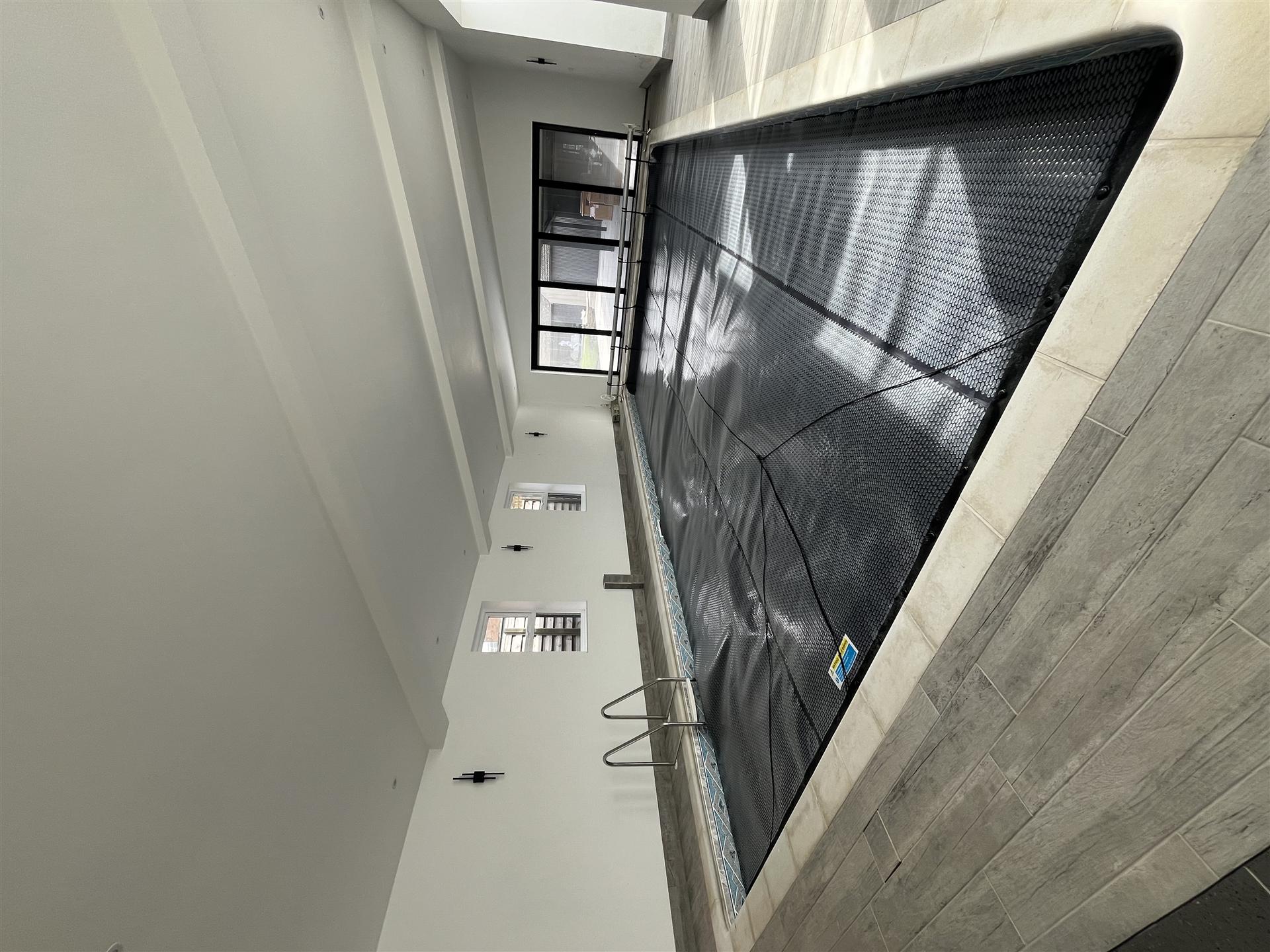 Indoor pool room with white painted walls, Essex